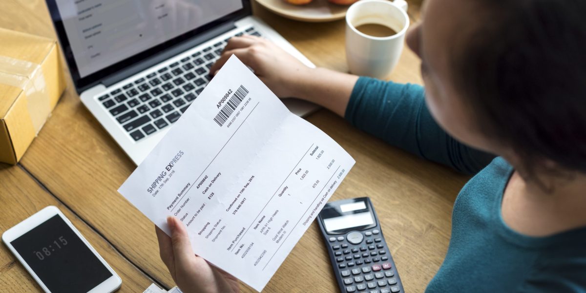 Woman checking shipping letter